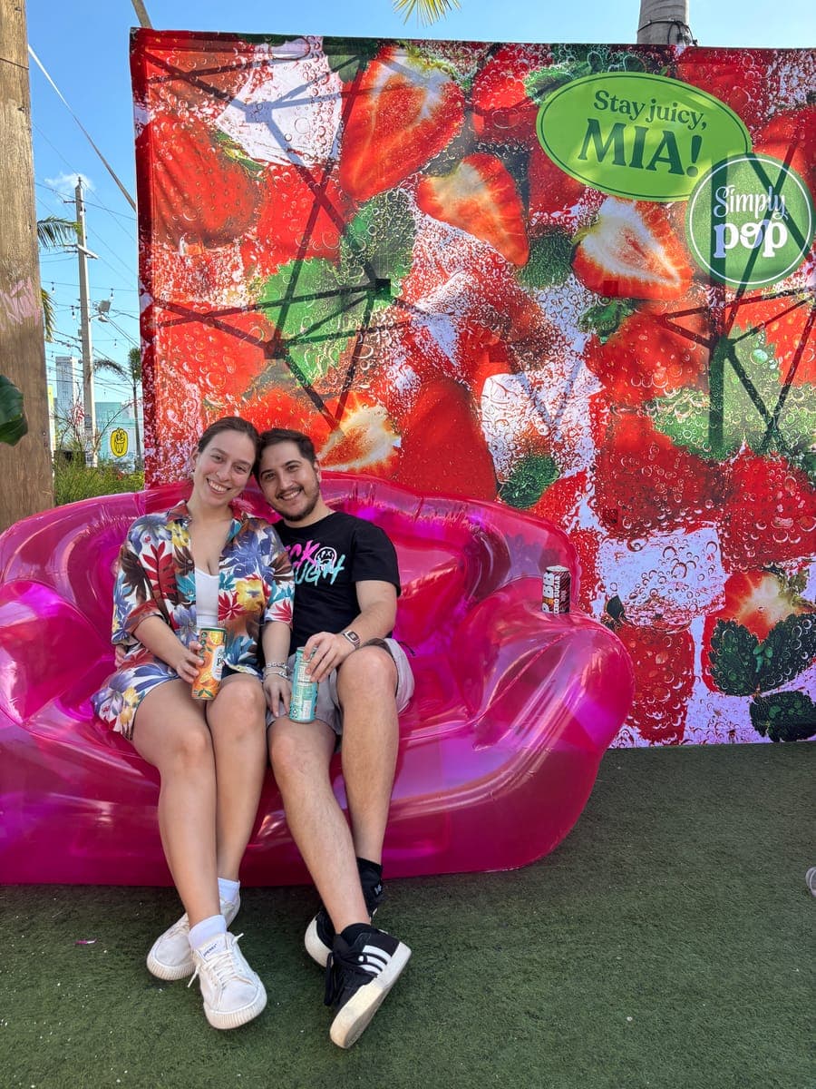 Mercedes and Michael on a pink inflatable couch in Miami